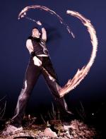 Fire Performer with fire swing